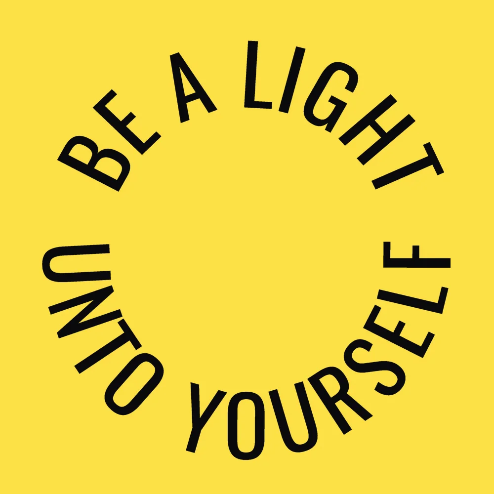 Zen wall clock: "be a light unto yourself — light yellow & near-black zinc"