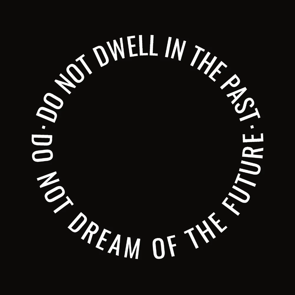 Zen wall clock: "do not dwell in the past do not dream of the future — near-black stone & white"