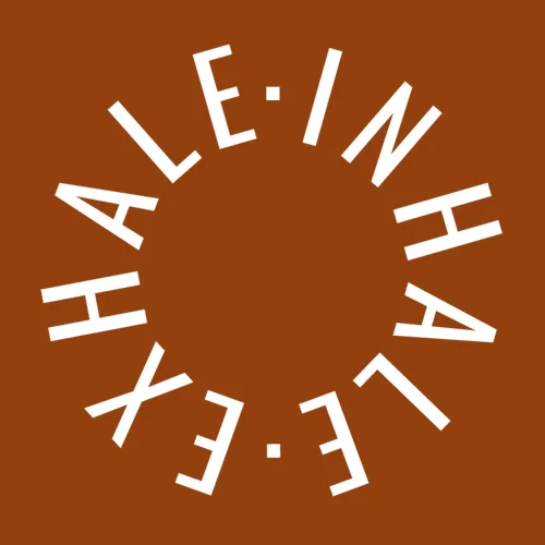Zen wall clock: "inhale exhale — dark amber & white"