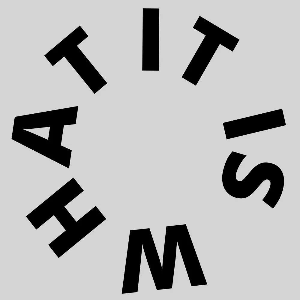 Funny wall clock: "It is what — light neutral & black"