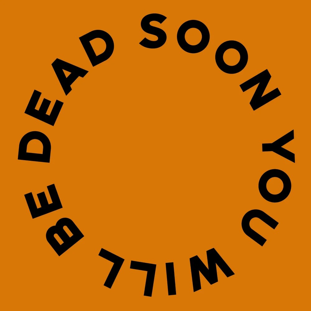 Funny wall clock: "Soon you will be dead — amber & black"