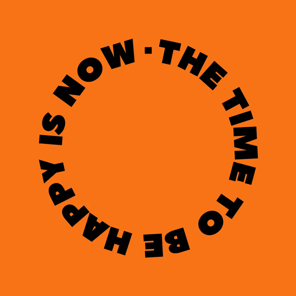 Zen wall clock: "the time to be happy is now — orange & black"