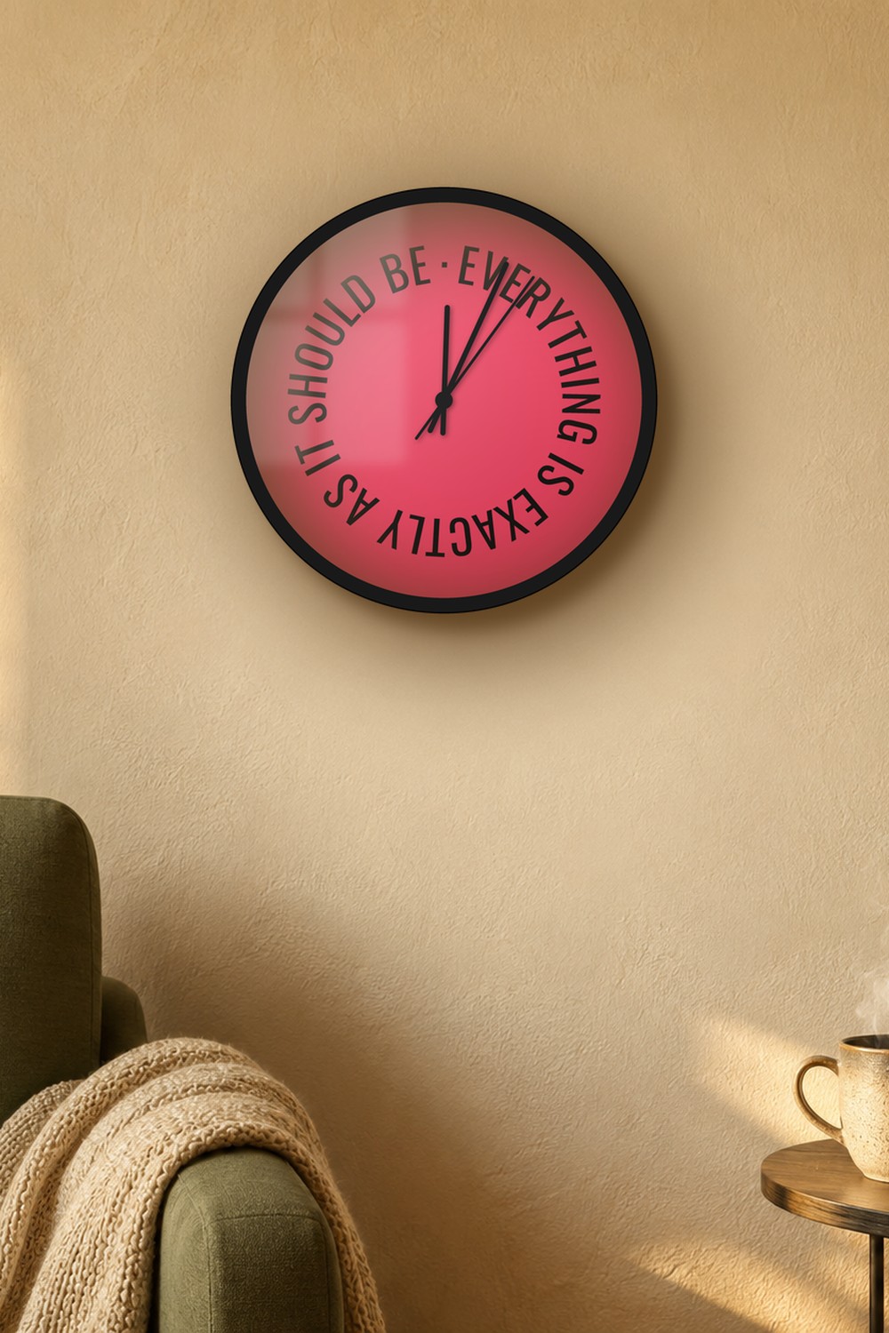 "everything is exactly as it should be" wall clock in rose and near-black stone, on a wall