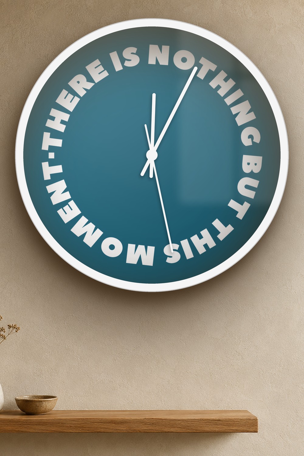 "there is nothing but this moment" wall clock in dark cyan and white, on a wall