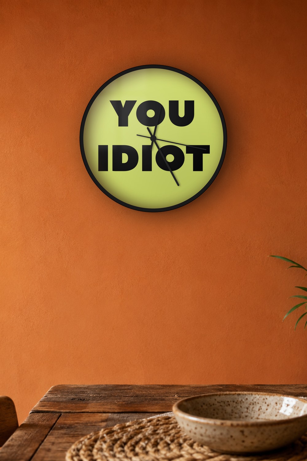 You idiot — light olive & black on a wall