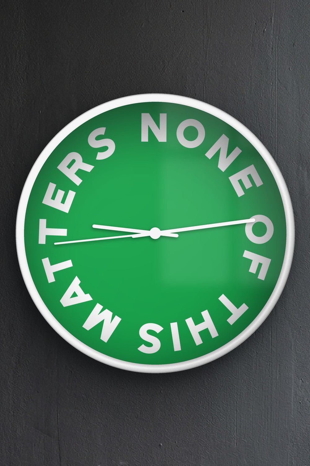 "None of this matters" wall clock in green and white, on a wall